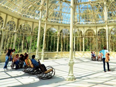 Sit in a rocking-chair in the Crystal Palace in Madrid