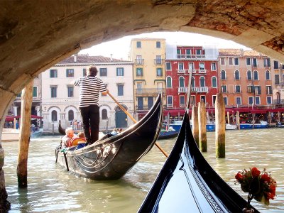 Take a gondola ride through Venice canals in Venice