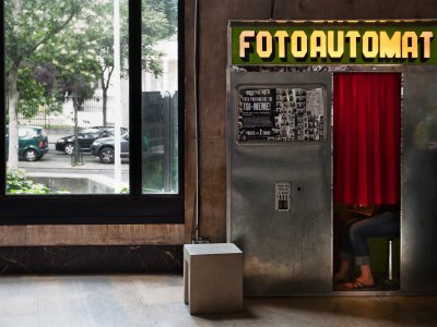 Take a selfie in a photo booth in Paris