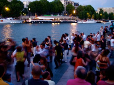 Dance tango on the bank of the Seine in Paris