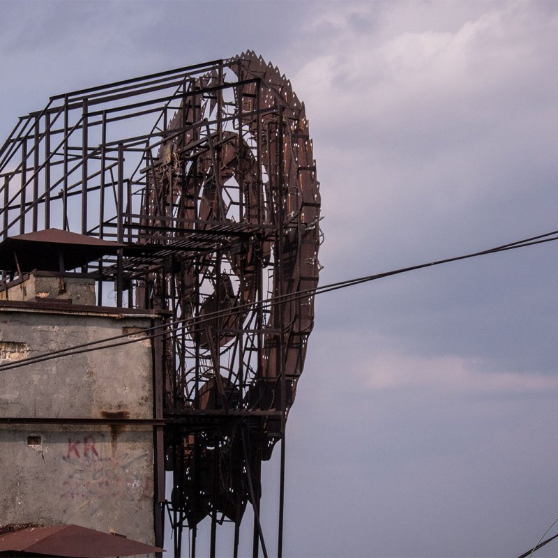 The USSR coat of arms on the roof of the building in Pripyat