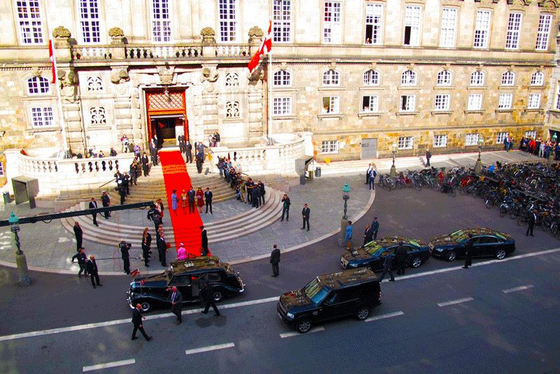 The visitors enter the parliament building through the tiny door in the left wing of the stairs, Copenhagen