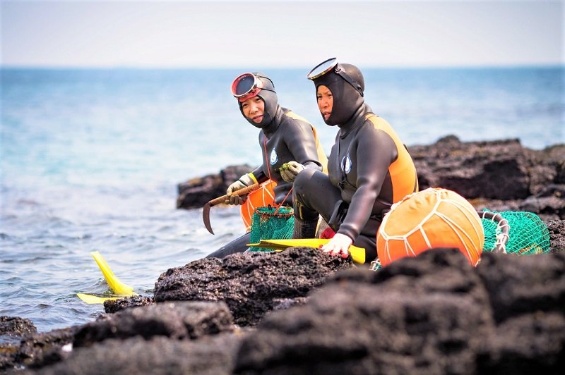 Haenyeo resting on the shore, Seogwipo