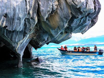 Ride a boat through a marble cave in Coyhaique