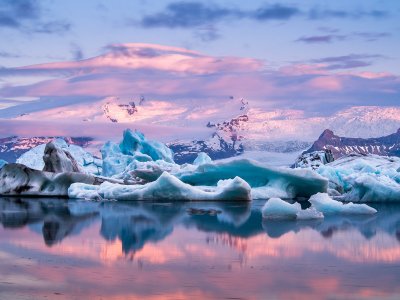 See a sunset over floating icebergs in Reykjavik
