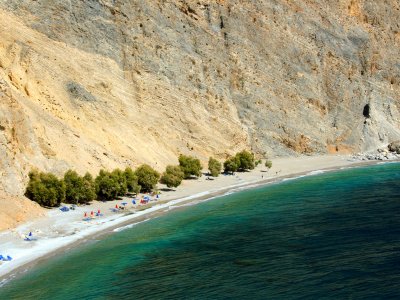 Sunbathing on a secluded beach Glyka Nera on Crete